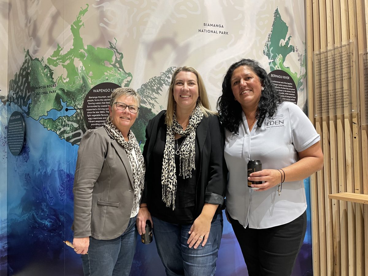 Three people at the launch of the Sapphire Coast Oyster Trail at Merimbula Visitor Information Centre