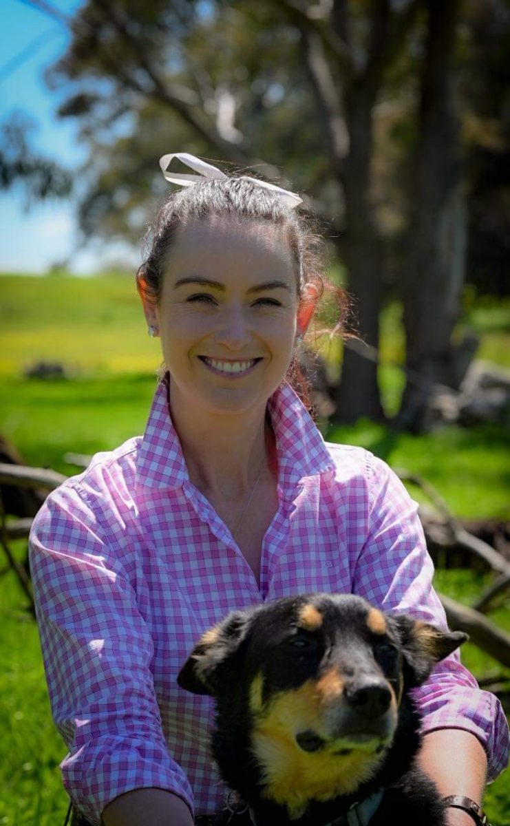 Woman in pink shirt with dog