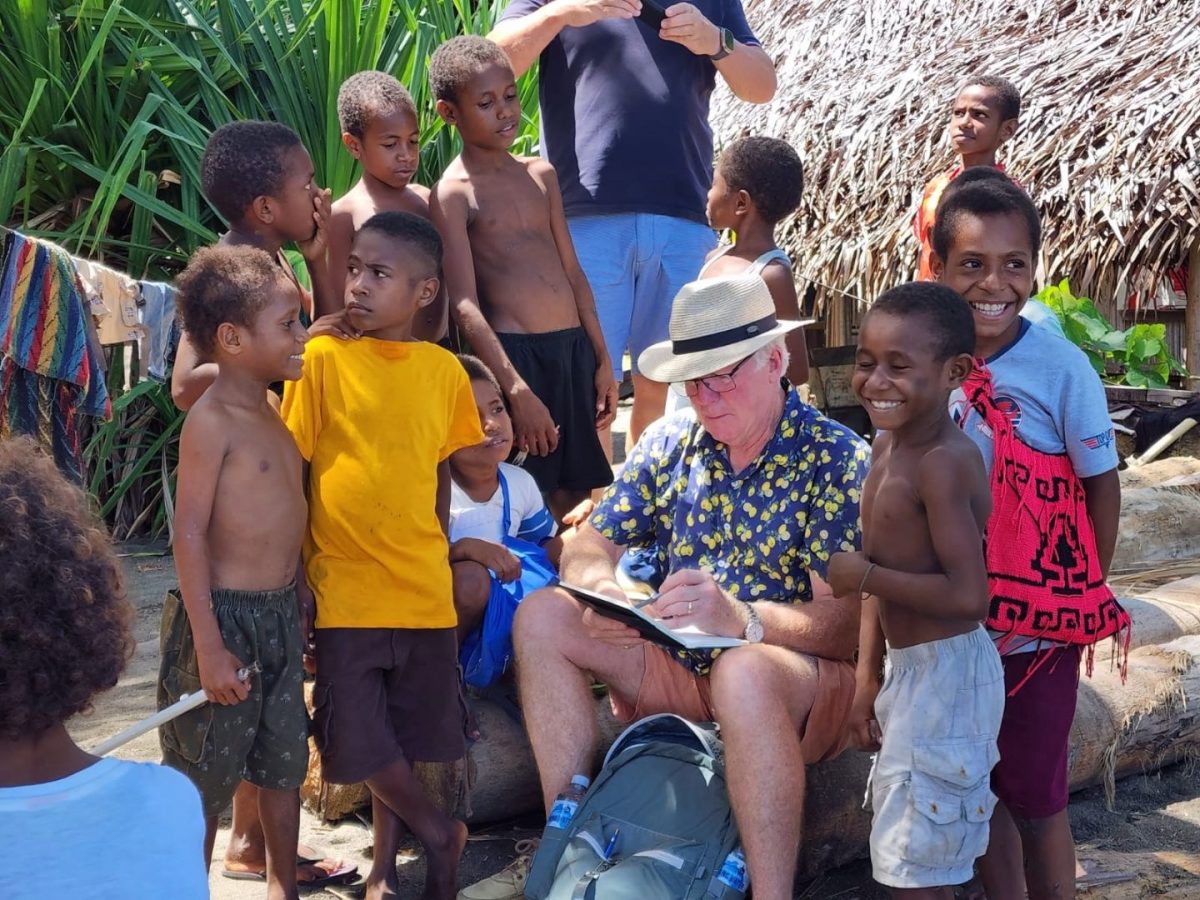 man and boys in PNG