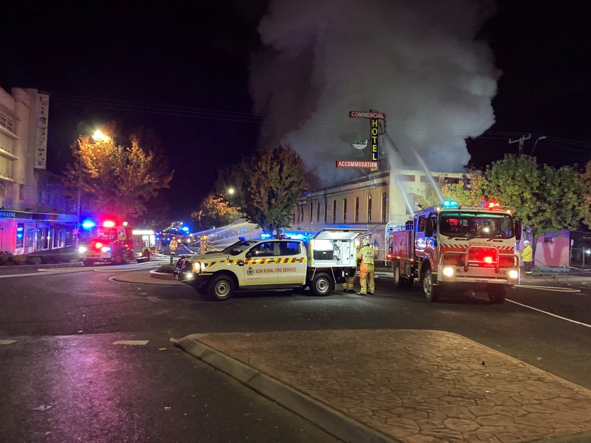 Fire trucks and other emergency vehicles in a dark street