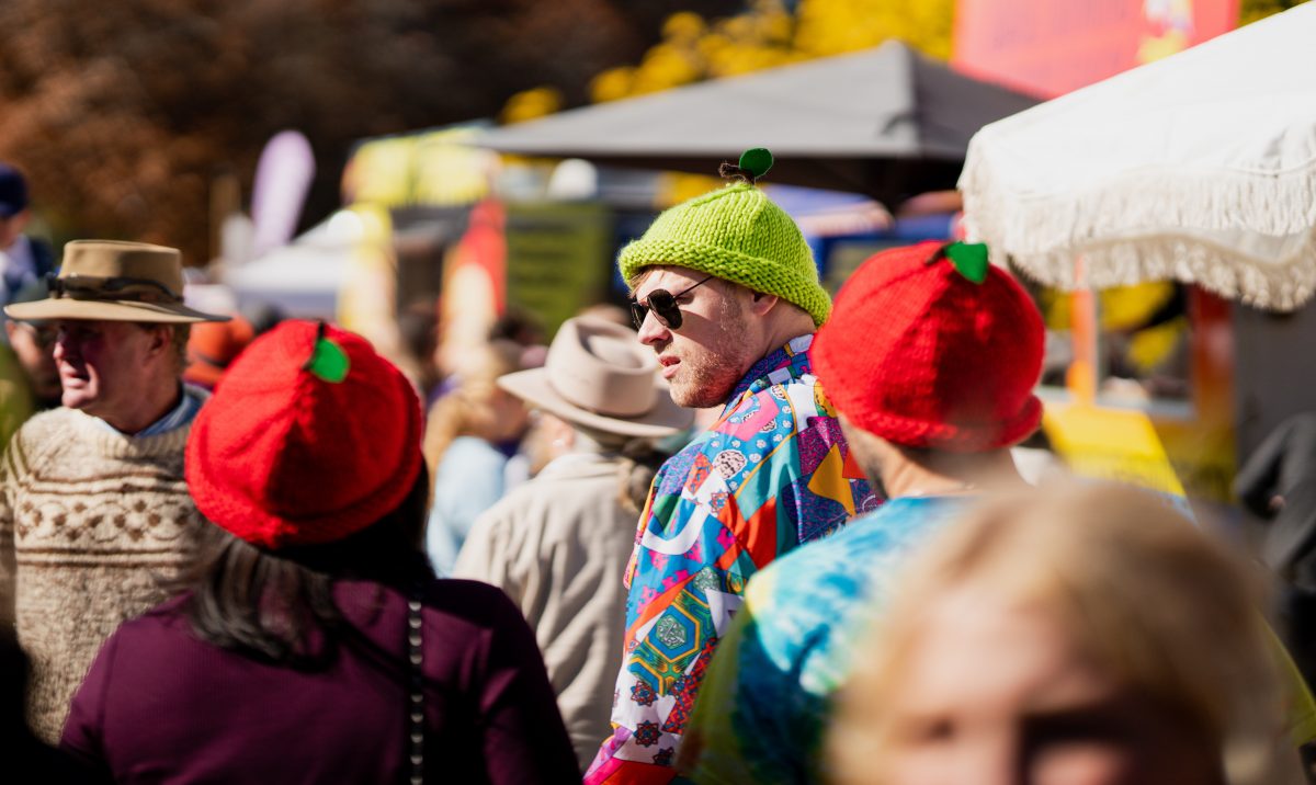 People wearing CiderFest beanies