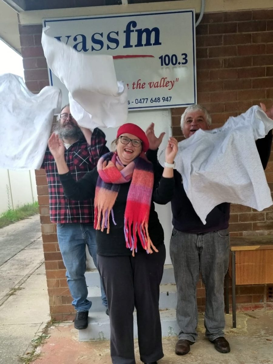 Three people with t-shirts