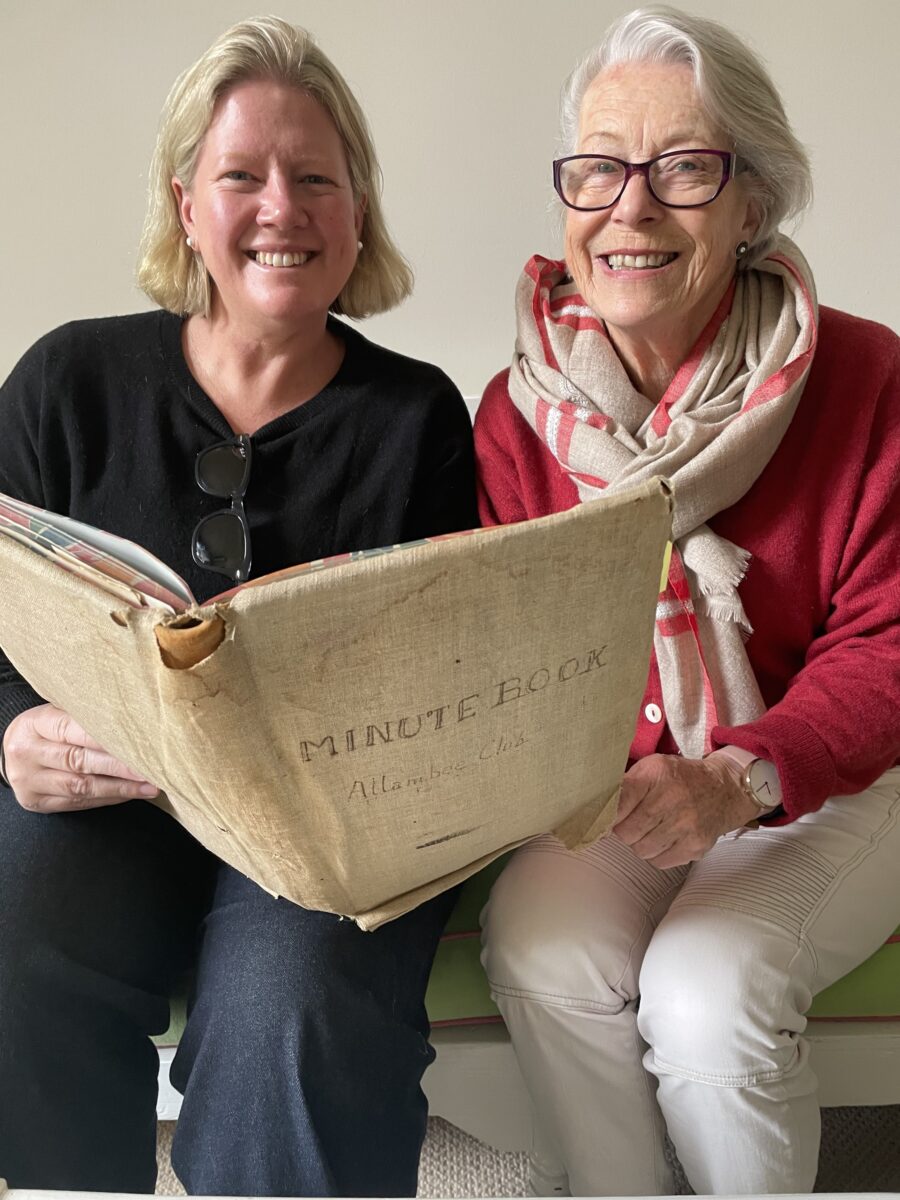 Two women with old book