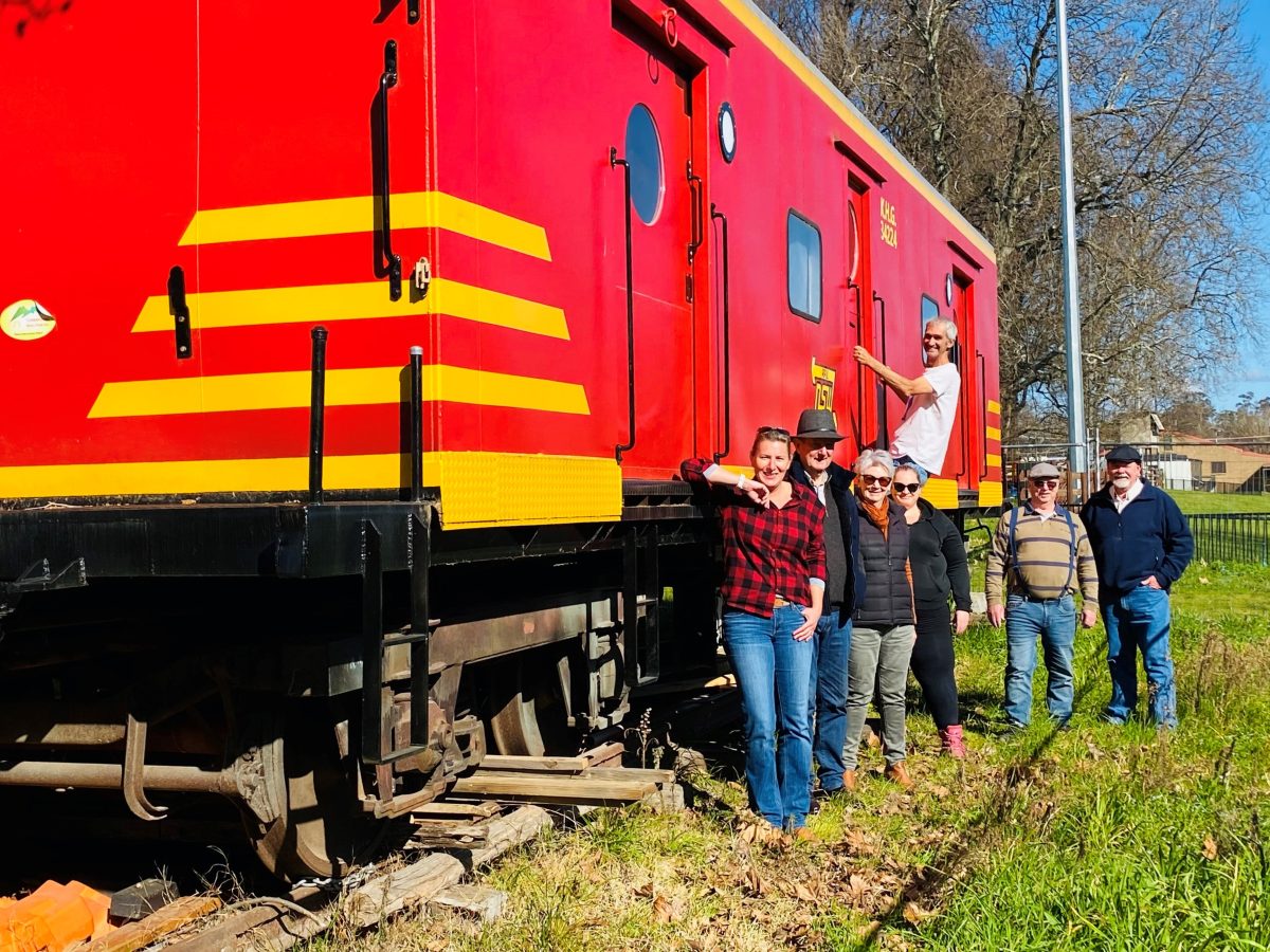 people with restored train guards' carriage