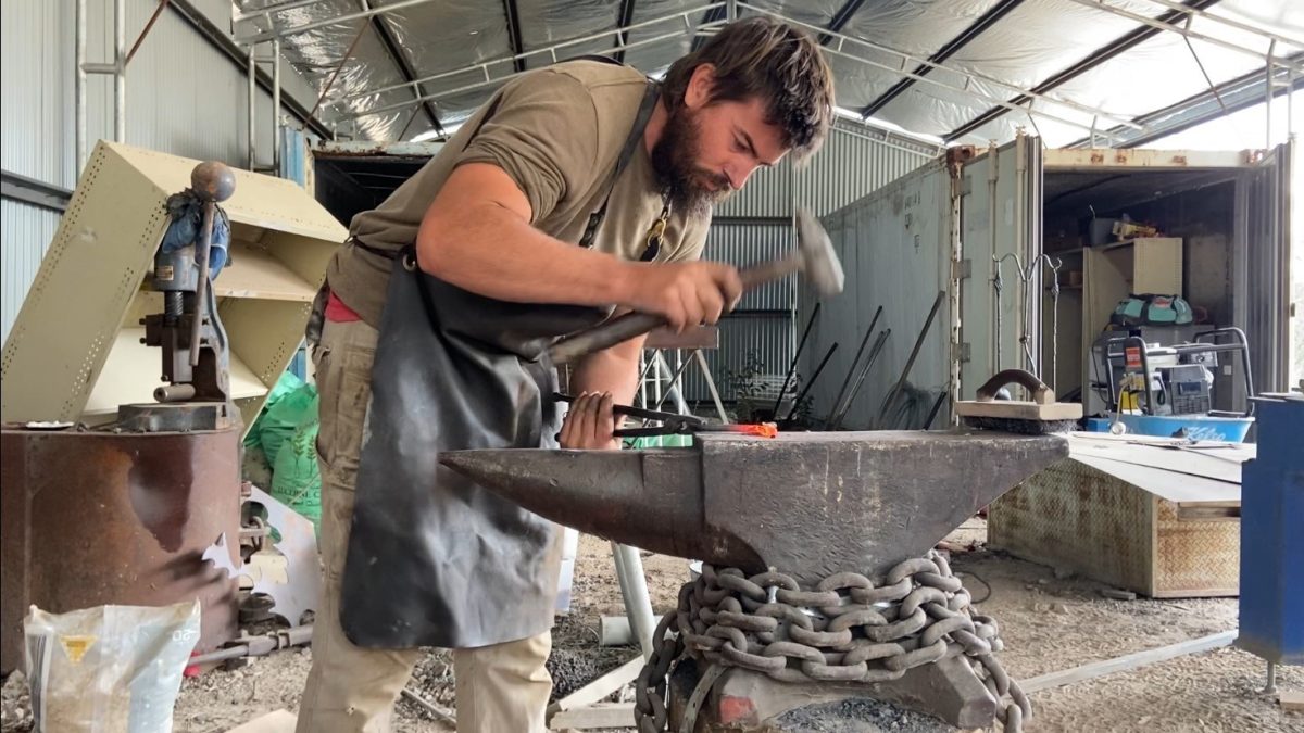 Blacksmith working on forge