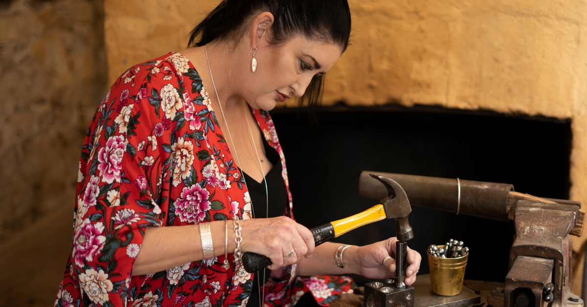 Woman artist working on jewellery