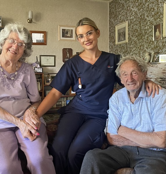 elderly couple with granddaughter