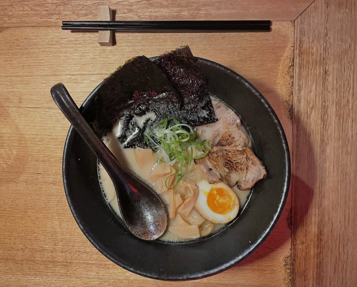 Pork ramen soup with garnishes and implements