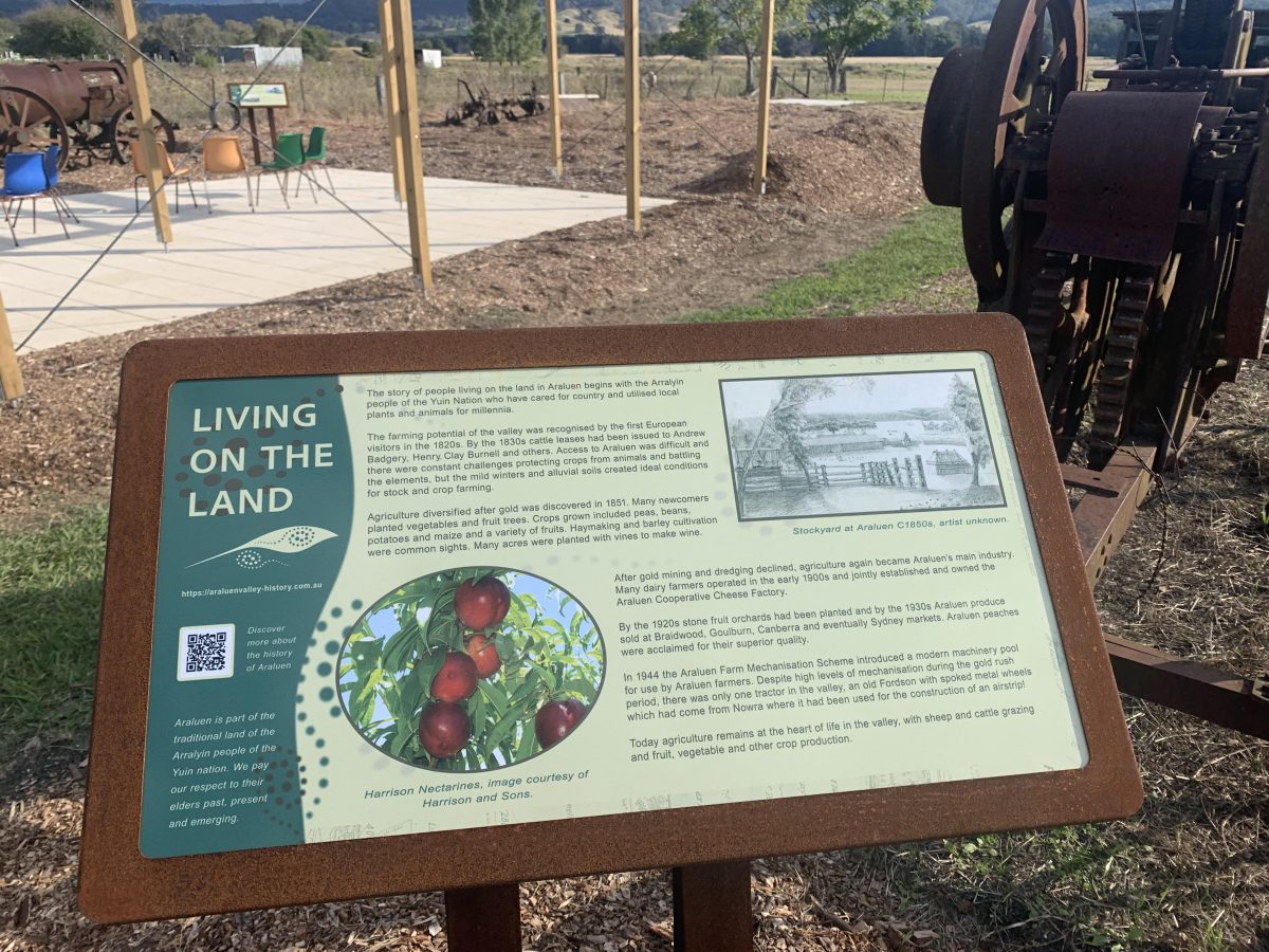 A photograph of a sign with local history information