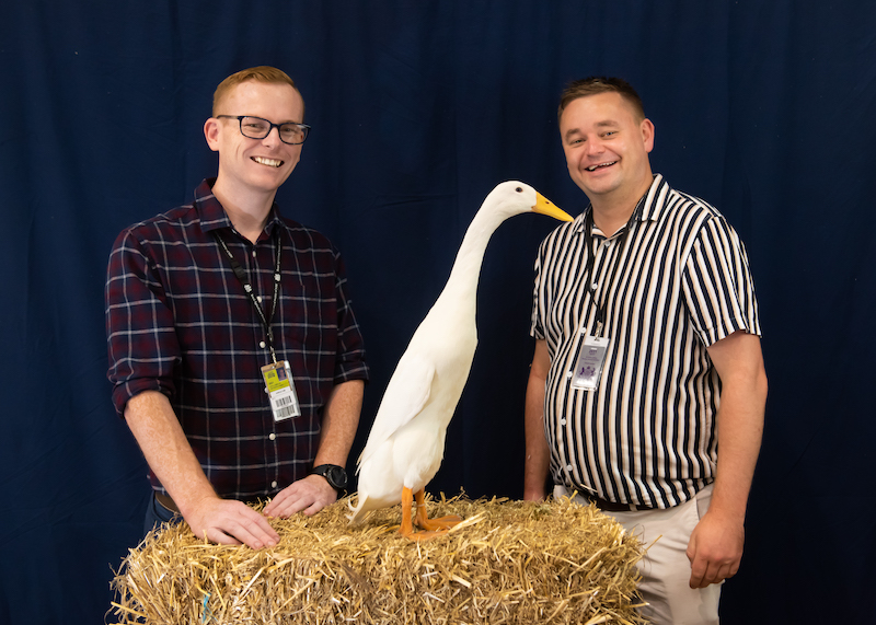 two men and a waterfowl