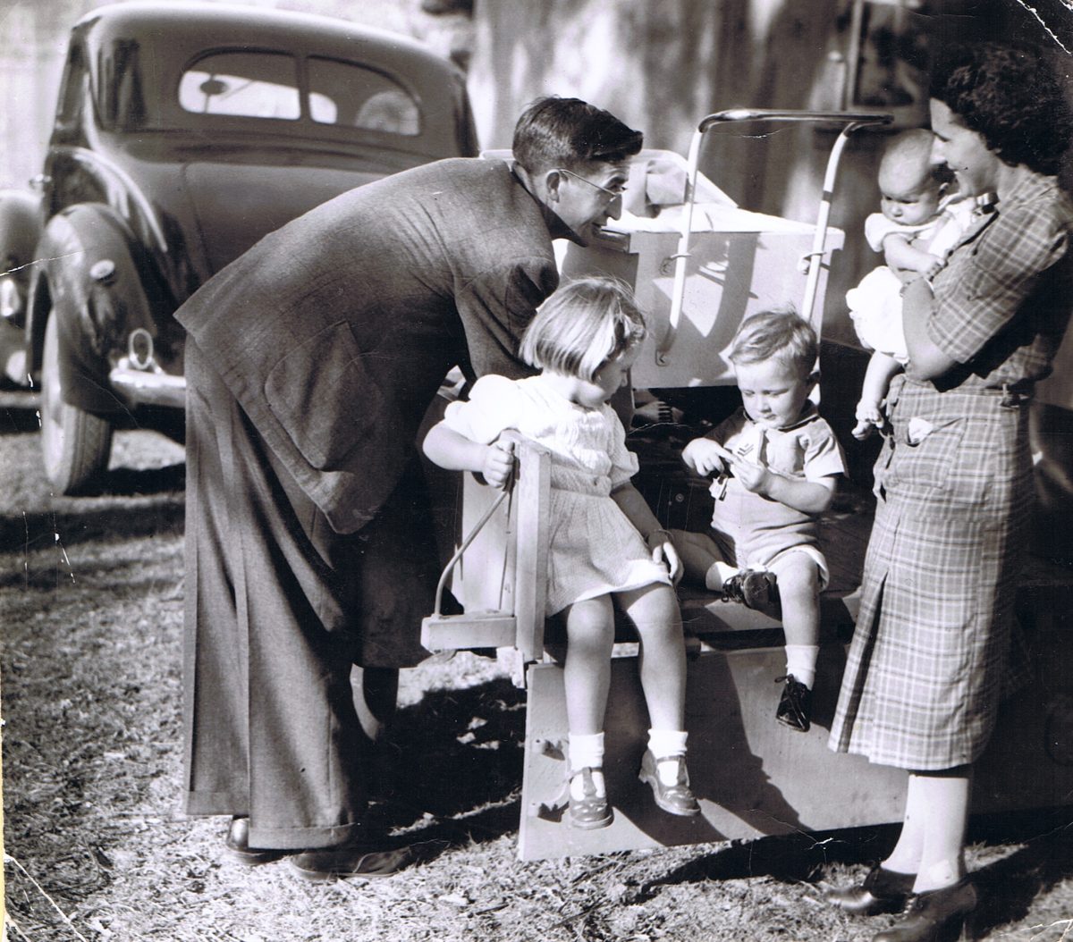 Frederick Dau and his wife at a church picnic in 1945/46 with his modified car in the background