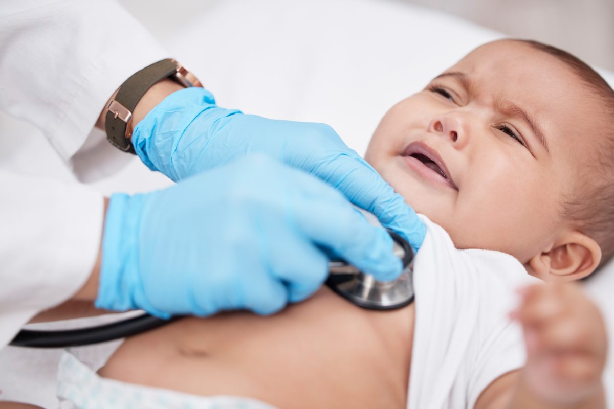 doctor examining baby