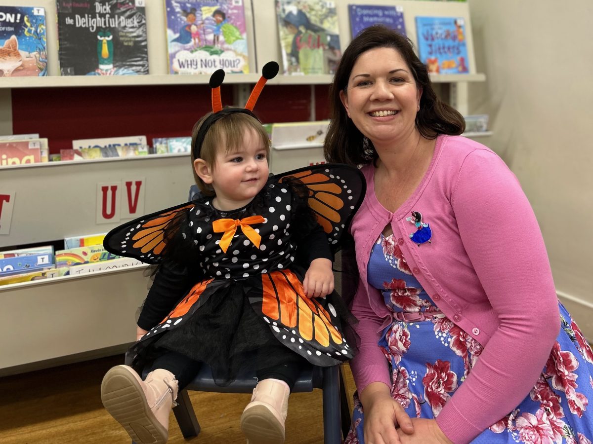 Librarian Michelle Morris with toddler Evelyn enjoying Book Week in the children's room at Goulburn Mulwaree Library.