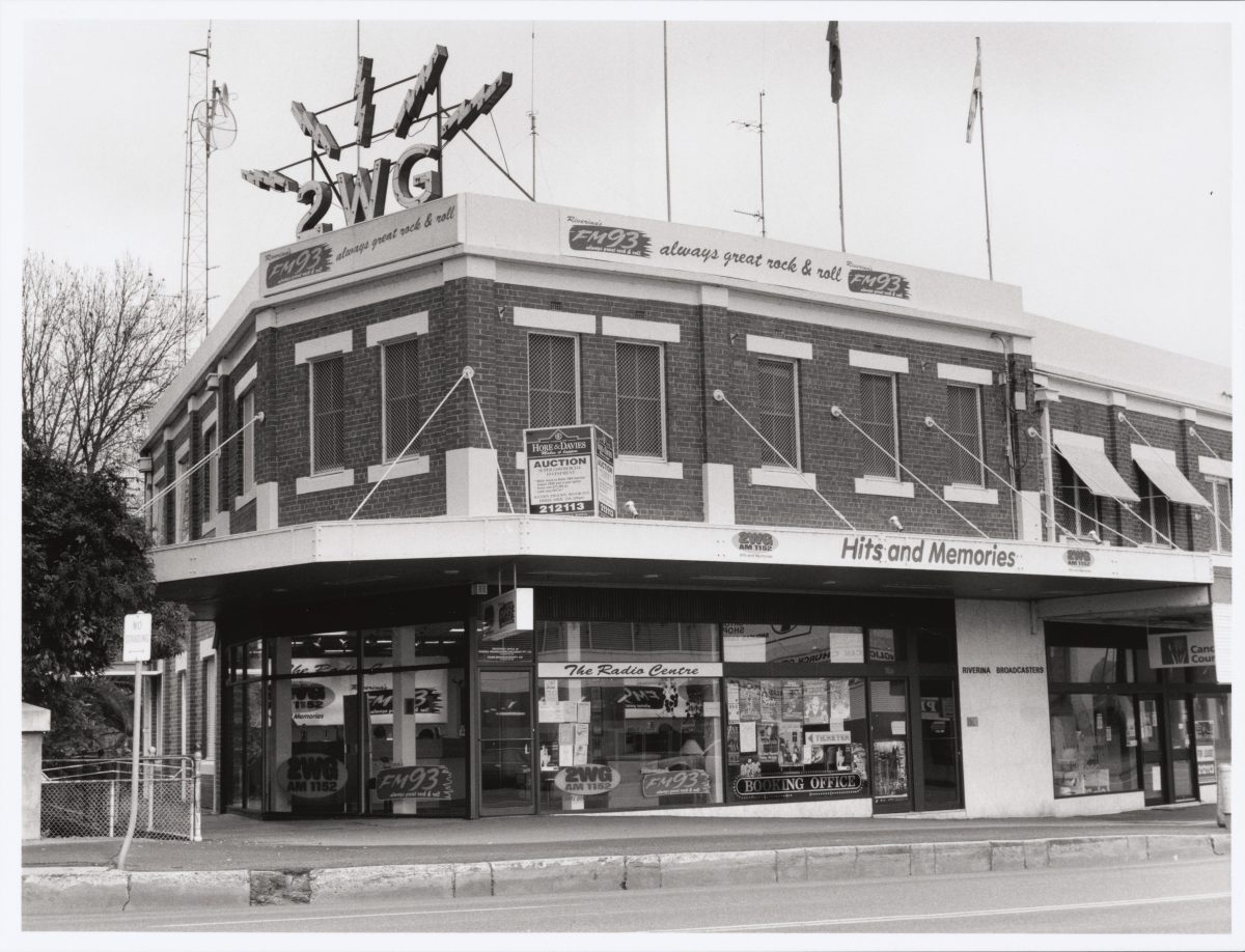 Two-storey building with radio signage on the roof 