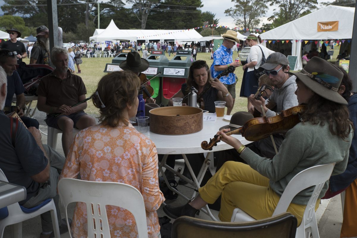 People sitting around and playing music