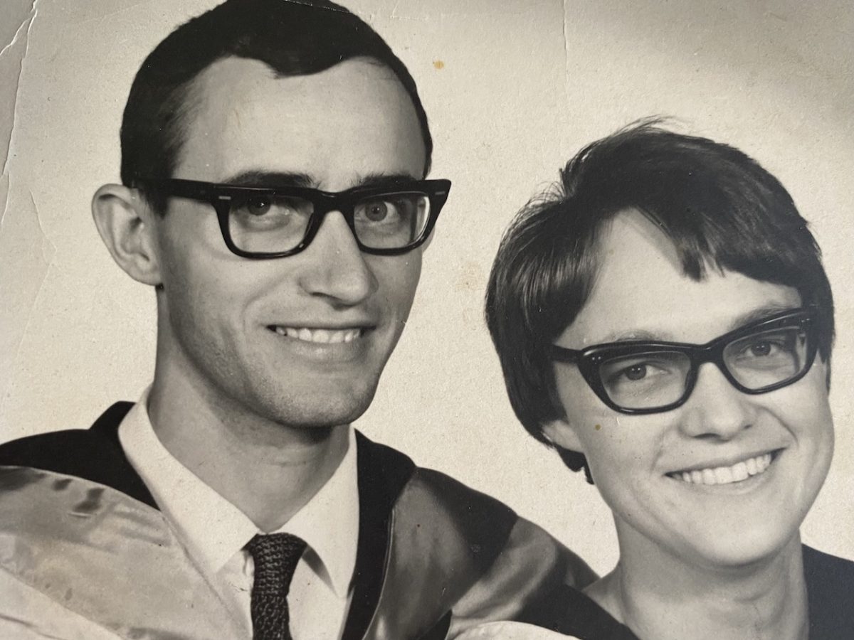 a smiling man and a smiling woman at their uni graduation in 1970