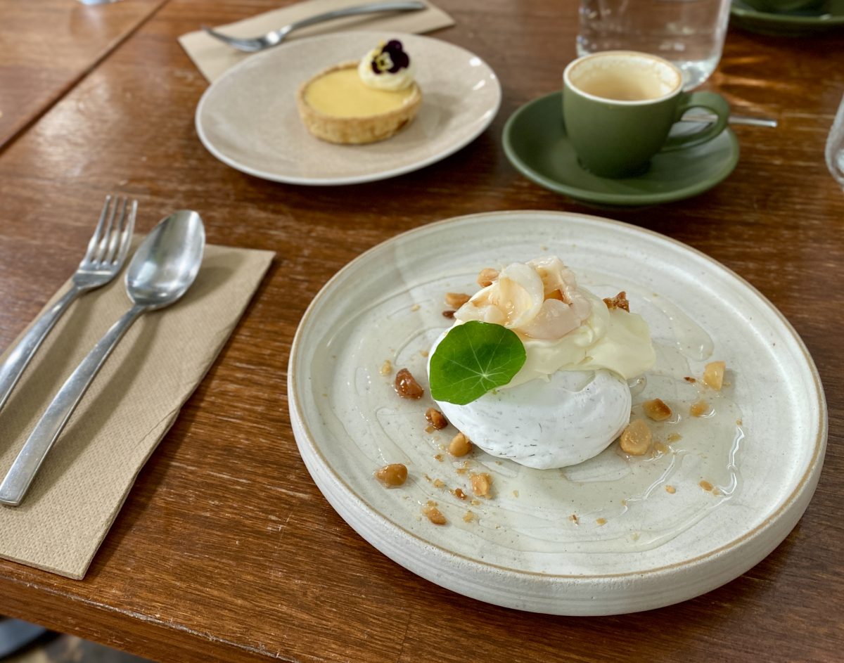 A meringue garnished with a nasturtium leaf