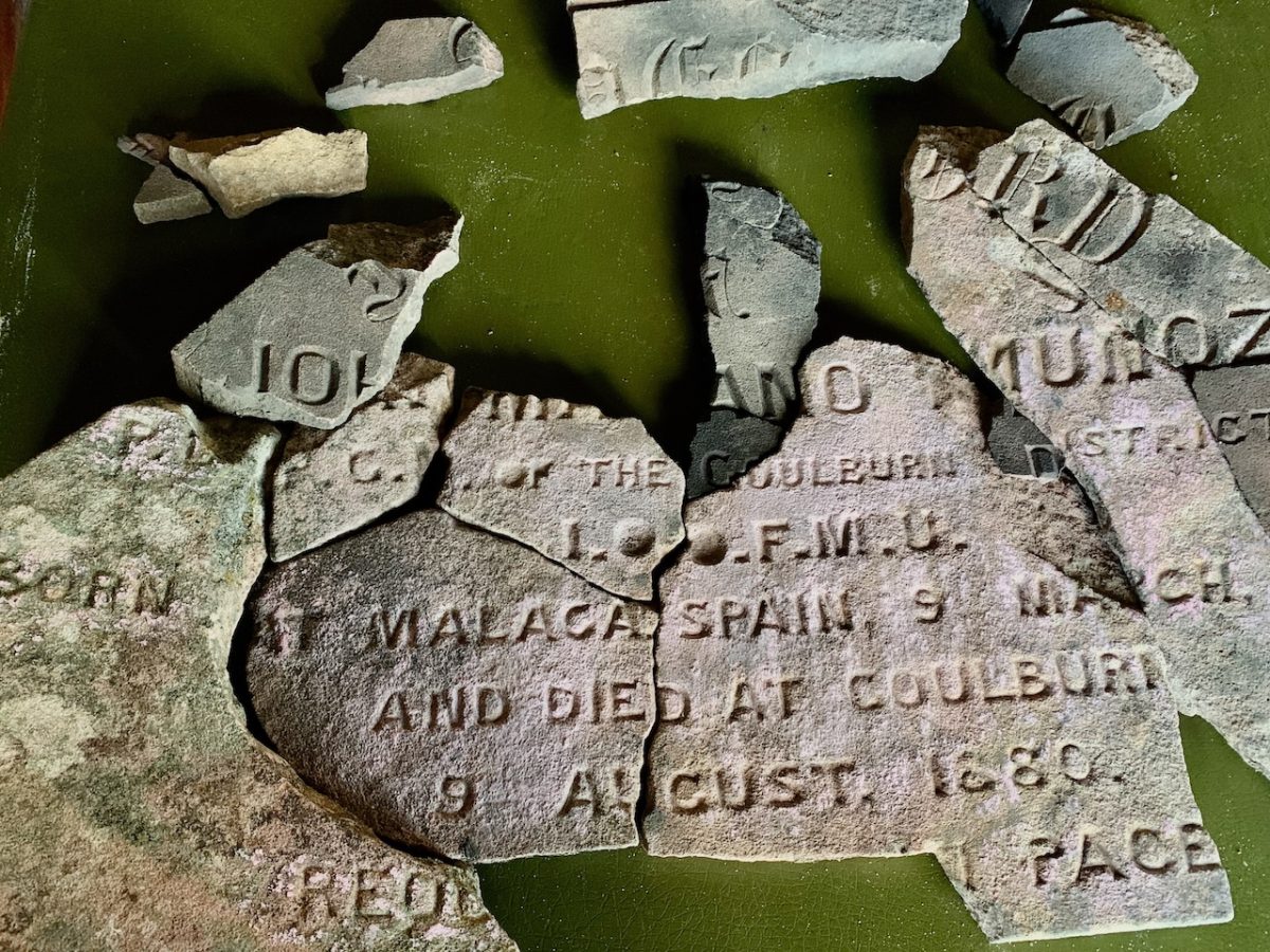 pieces of an old headstone