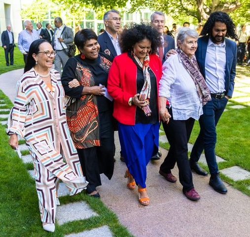 Linda Burney and others walking arm in arm