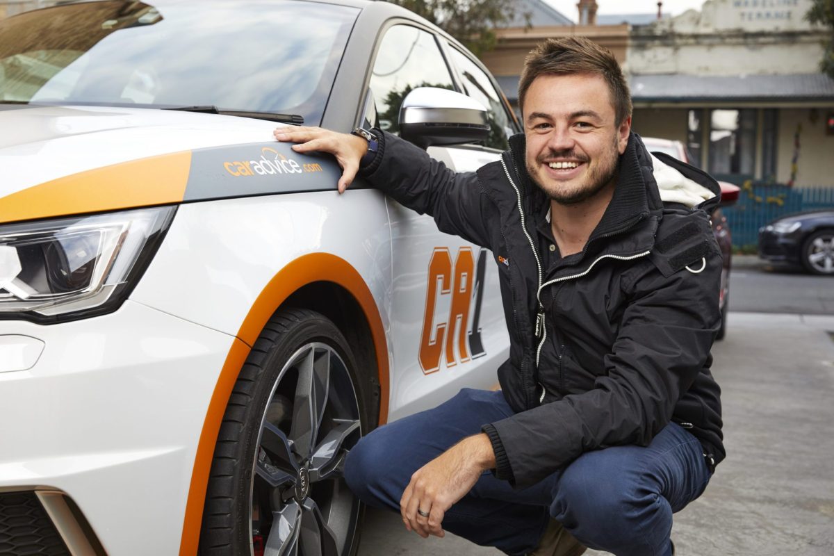 Paul Maric next to a car 