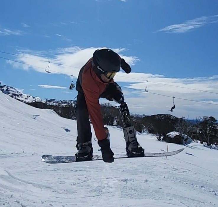 Aaron was able to snowboard down a beginners course at Thredbo just hours after being fitted with a specialised prosthetic leg. 