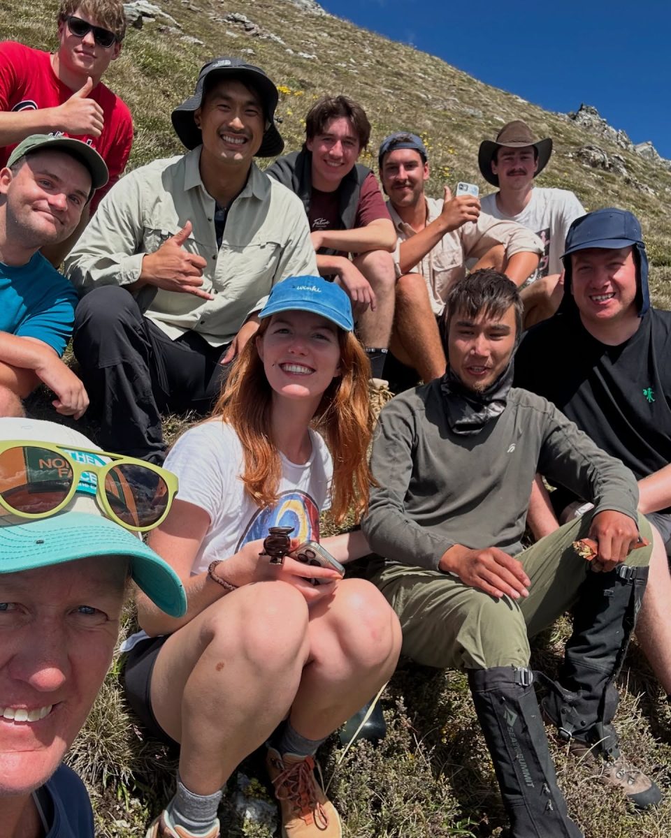 Josh Dart (right) with Hadi Nazari and fellow hikers in the moments after he was found. 